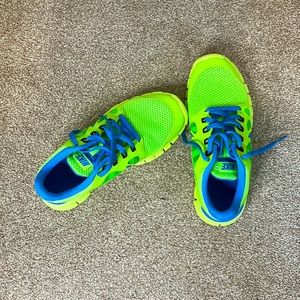 Lime green and blue Nike sneakers